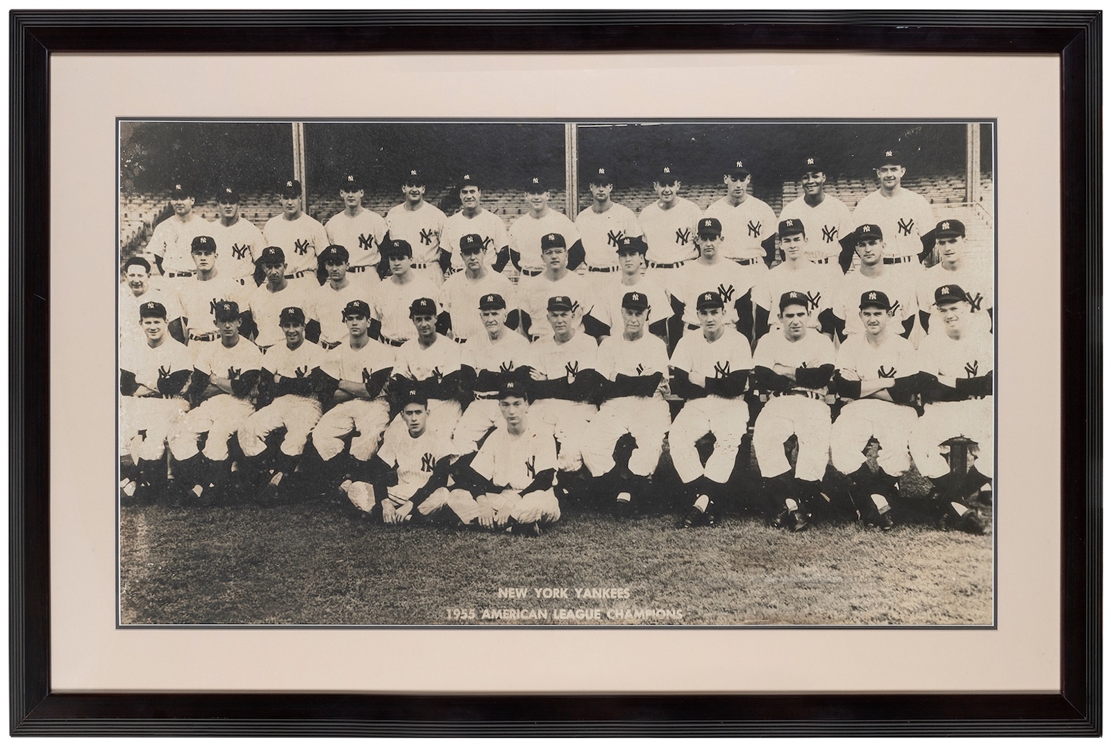 A 1955 New York Yankees large-format team photograph, is estimated at $800-1,200.