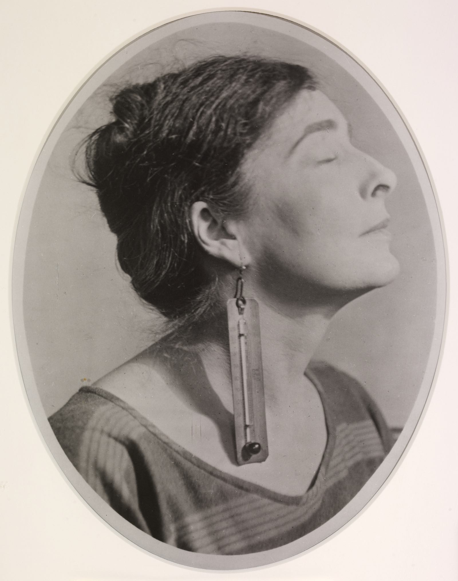 Man Ray, Mina Loy, 1920, gelatin silver print, 6 1/2 x 5 1/8 in. (16.51 x 12.95 cm). Private collection.