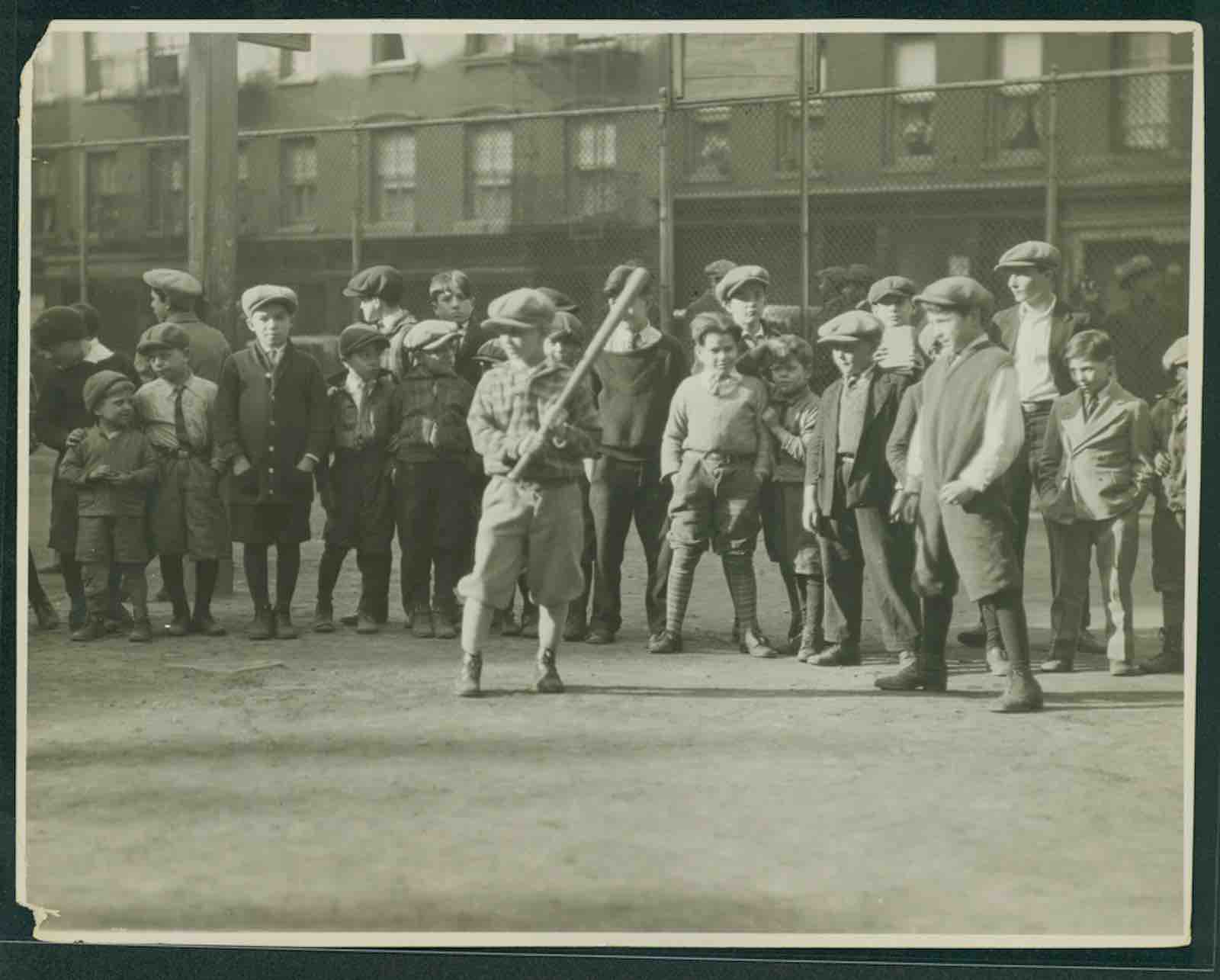 Paul Parker (active first half of the 20th century), Boys playing baseball in a school yard, 1915-32. Gelatin silver print.
